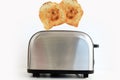 Roasted toast bread popping up of stainless steel toaster