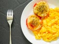 Roasted tomatoes with mozzarella cheese and scrambled eggs Royalty Free Stock Photo