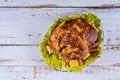 Roasted turkey with corn and lettuce on plate