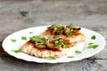 Roasted Turkey fillet with cheese and agaricus on a plate and on old wooden background. Closeup Royalty Free Stock Photo