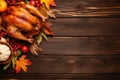 Roasted turkey with fruits on rustic wooden table. Thanksgiving dinner with baked poultry. Tasty food