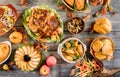 Roasted turkey garnished with many dishes on the table. Thanksgiving Day Royalty Free Stock Photo