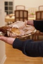 Roasted turkey on plate. Person holds traditional roasted turkey for dinner. Thanksgiving dinner atmosphere Royalty Free Stock Photo