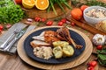 Roasted turkey served on a plate with farofa, crumbs and boiled potatoes. Thanksgiving Day and Christmas dinner Royalty Free Stock Photo