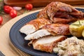 Roasted turkey served on a plate with farofa, crumbs and boiled potatoes. Thanksgiving Day and Christmas dinner Royalty Free Stock Photo