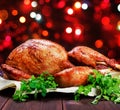 Roasted Turkey. Thanksgiving table served with turkey, decorated with greens and basil on dark wooden background. Homemade food Royalty Free Stock Photo