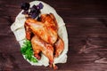 Roasted Turkey. Thanksgiving table served with turkey, decorated with greens and basil on dark wooden background. Homemade roasted Royalty Free Stock Photo