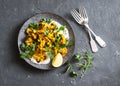 Roasted turmeric cauliflower with greek yogurt dressing. Delicious healthy snack on a dark background