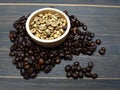 Roasted and unroasted coffee beans Royalty Free Stock Photo