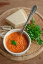 Roasted vegetable dip, sauce, spread in a ceramic bowl on a woo