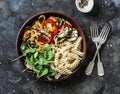 Roasted vegetables and fusilli pasta antipasti salad on dark background, top view Royalty Free Stock Photo