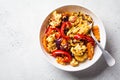 Roasted vegetables salad with bulgur in white bowl. Vegan food concept Royalty Free Stock Photo