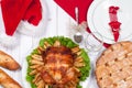 Roasted whole chicken and apple pie with Christmas dinner Royalty Free Stock Photo