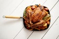 Roasted whole chicken in cast iron black pan