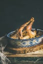 Roasted whole chicken for Christmas, black wall background, copy space Royalty Free Stock Photo