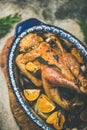 Roasted whole chicken with orange for Christmas eve celebration table Royalty Free Stock Photo