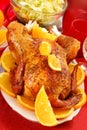 Roasted whole chicken with oranges