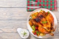 Roasted whole chicken, potatoes, baby carrots, eggplants, green Royalty Free Stock Photo