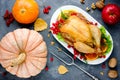 Roasted whole chicken or turkey on plate and autumn vegetables Royalty Free Stock Photo