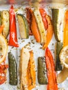 Roasted winter vegetables on aluminium foil on tray,pepper, zucchini, carrot, celery, tomato. Top view. Royalty Free Stock Photo