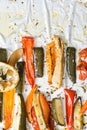 Roasted winter vegetables on aluminium foil on tray,pepper, zucchini, carrot, celery, tomato. Top view. Royalty Free Stock Photo