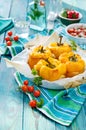 Roasted yellow bell peppers stuffed with quinoa, mushrooms and cheese. Cherry tomatoes baked with parmesan Royalty Free Stock Photo