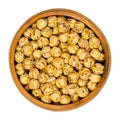 Roasted yellow chickpeas in wooden bowl