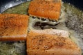 Roasting Arctic char fillet pieces in skillet