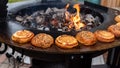 Roasting buns with sesame seeds for a hamburger on the grill.