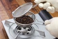 Roasting coffee beans process by handy roaster at home