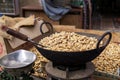 Roasting ground peanuts in an iron wok Mandawa Royalty Free Stock Photo