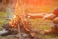 Roasting marshmallows on stick at bonfire Royalty Free Stock Photo