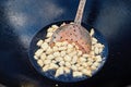 Roasting of mutton fat to a condition of crackers, some stage of preparation of a national Uzbek dish pilaf, shovel for