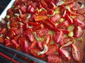 Roasting tomatoes with onion and garlic Royalty Free Stock Photo