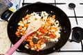 Roasting vegetables in a pan.