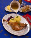 Roasty duck leg with braised red cabbage and dumplings Royalty Free Stock Photo