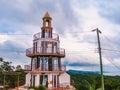 Roatan, Honduras, El Faro Lighthouse in West Bay. Landscape of the island with a blue sky and green vegetation in the background Royalty Free Stock Photo