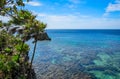 Roatan island Honduras. Landscape, seascape of a tropical blue turquoise clear ocean water, reef. Blue sky in the background. Gree Royalty Free Stock Photo