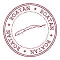 Roatan round rubber stamp with island map.