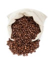 Roated coffee beans spill out of the bag Royalty Free Stock Photo