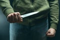 A robber with a big knife - a sharp-assassin murderer about to commit murder, robbery, theft. News articles, newspaper, social