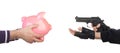 Robber with gun taking piggy bank from victim Royalty Free Stock Photo