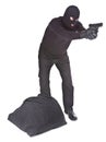 Robber with sack aiming with his gun Royalty Free Stock Photo