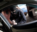 Robber and the thief in a mask hijacks the car Royalty Free Stock Photo