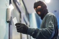 Robber using electronic key for acceess Royalty Free Stock Photo