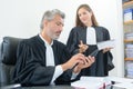 Robed legal workers in discussion