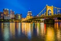 The Roberto Clemente Bridge and Pittsburgh skyline at night, seen from Allegheny Landing, in Pittsburgh, Pennsylvania