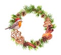 Robin bird in red holiday hat, ginger cookies, cinamon, orange. Christmas wreath with fir tree branches, cones. New year