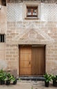 Main facade of a house decorated with ancient frets, filigree and drawings