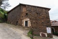 An old house built with slate and adobe stones covered by dry ivy Royalty Free Stock Photo